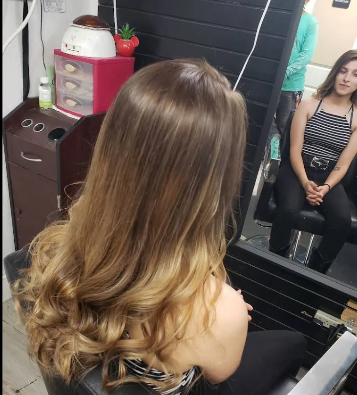 Long hair with a hand-painted balayage from brown to blonde.