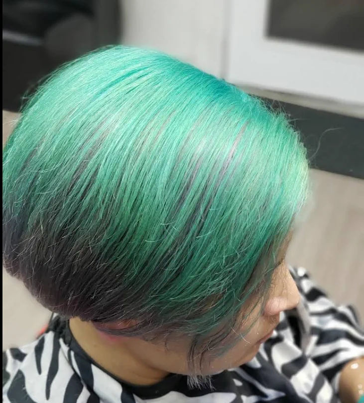 Short bob in a bright green color melt.